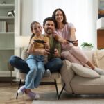 front view family playing videogame