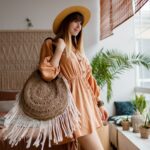 woman linen dress chilling home looking window